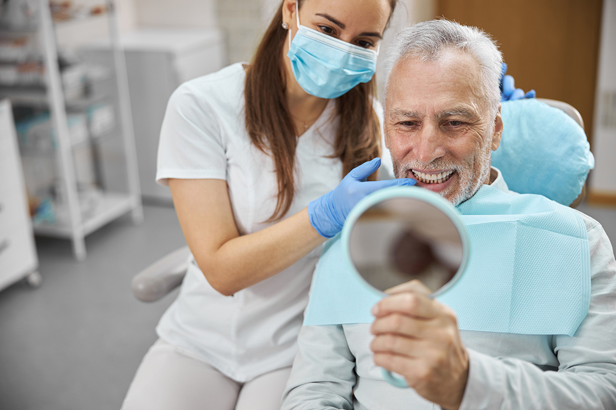 Dentist placing a dental restoration